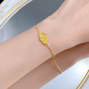 Detail of S925 silver gold floral bracelet with matte petals and small crystals