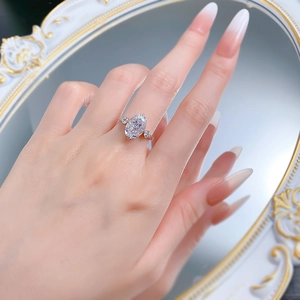 Close-up of S925 silver gold-plated ring with an oval ice-cut high carbon diamond on hand