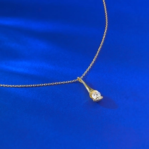 Elegant gold-plated S925 silver necklace with teardrop cone pendant and round white zircon