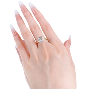 Elegant gold S925 silver ring featuring a large rectangular emerald cut clear gemstone