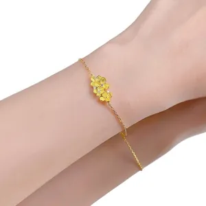 Elegant gold flower bracelet for women with dainty petals and sparkling crystal centers