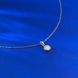 S925 sterling silver necklace featuring a 5.0mm round cut solitaire pendant on blue silk