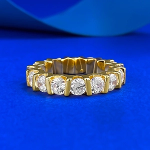 Detailed view of a gold-plated eternity ring with round-cut sparkling zircons