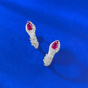 Elegant S925 sterling silver pear-cut red zircon snake drop earrings on blue background