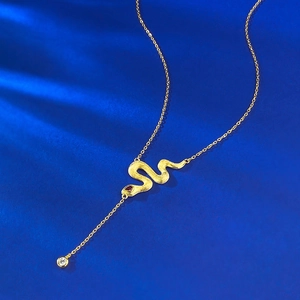 Golden snake necklace with brushed finish, red gemstone eye and zirconia drop pendant