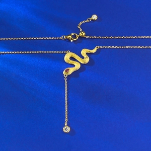 Golden brushed snake pendant necklace with red gemstone eyes and adjustable Y-shape chain