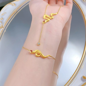 Elegant gold-tone S925 snake jewelry set with brushed finish and red gemstone eyes