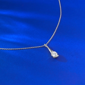 S925 sterling silver drop pendant necklace with zircon on elegant blue silk backdrop