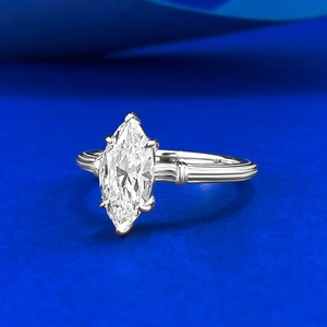 Macro detail of marquise-cut stone with six-prong setting on textured S925 silver band