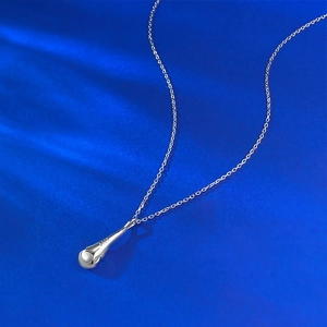 Detail of S925 sterling silver stamp on the waterdrop pendant with shiny metal finish