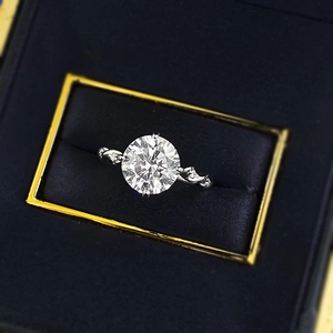 Macro shot of S925 silver four-prong round zircon ring with twisted pavé vine band