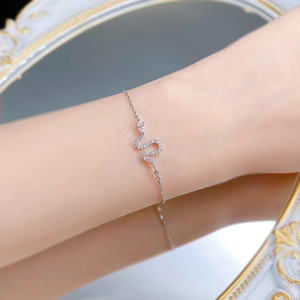 Exquisite S925 sterling silver snake bracelet with sparkling zircon stones on female wrist