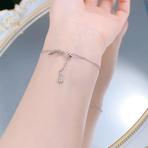 Detail of adjustable S925 silver snake chain with lobster clasp and zircon drop charm