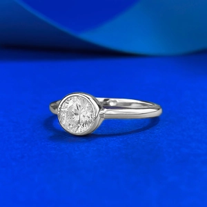 Macro shot of 925 silver ring featuring a 6mm round solitaire diamond in bezel setting