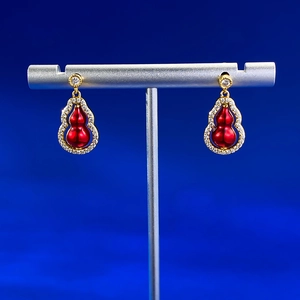 Boucles d'oreilles gourde pivotantes double face rouge et or avec cristaux argentés