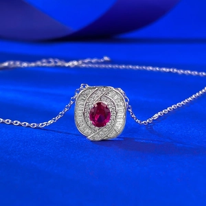 Detail of S925 silver necklace featuring an oval red gem with art deco zircon framing
