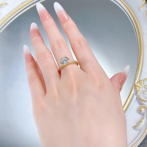 Detailed view of an S925 silver gold-plated ring with a 8mm round white diamond on a hand