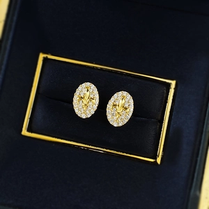 Gold oval Fleur-de-lis stud earrings with sparkling pave-set cubic zirconia stones