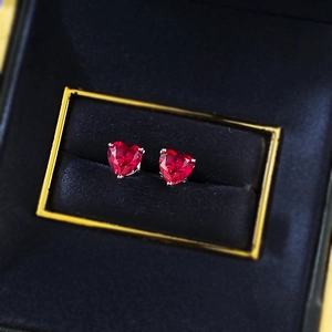 Elegant S925 silver heart stud earrings with pigeon blood red stones in a gift box