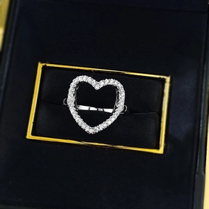 S925 sterling silver heart-shaped ring with pave small diamonds in a black velvet jewelry box