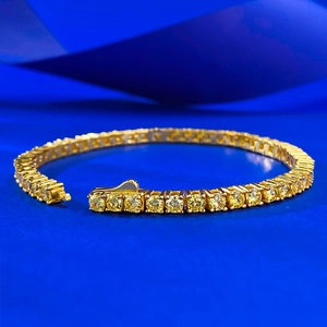 Bracelet tennis classique en or avec pierres jaunes rondes et sertissage à quatre griffes