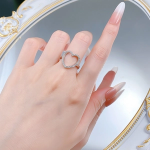 Elegant S925 sterling silver hollow heart ring featuring sparkling micro-pave crystals