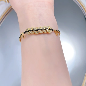 Detail of S925 silver Five Emperor Coins bracelet with black cord and sparkling zircons