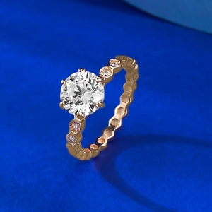 Rose gold six-prong round diamond ring with honeycomb band and side accents