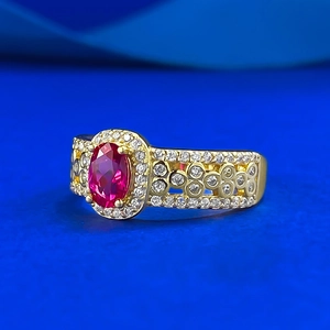 Luxurious S925 silver ring with oval ruby gemstone and golden pavé setting details