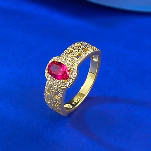 Detail view of gold-plated S925 silver ring with oval ruby and hollow band design