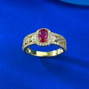 S925 silver gold-plated ring with oval ruby-red gemstone and halo of small diamonds