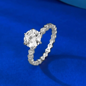 Close-up of S925 silver ring featuring a six-prong round diamond and honeycomb band detail