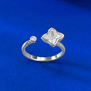 Macro view of S925 silver ring featuring a clover flower design and clear zircon stone