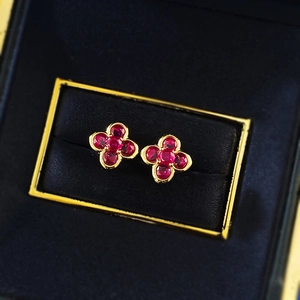 Elegant gold S925 silver four-leaf clover earrings with red round cut gemstones