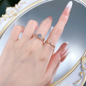 Rose gold stackable ring set with brilliant round-cut main diamond and wave diamond band