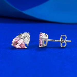 Macro detail of S925 sterling silver pear-cut pink and white gemstone teardrop earrings