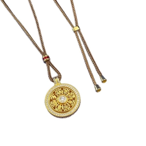 Golden S925 silver spinning compass pendant with hollow pattern on woven necklace rope