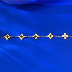 Bracelet trèfle doré élégant avec cinq motifs, bordure perlée et diamants étincelants