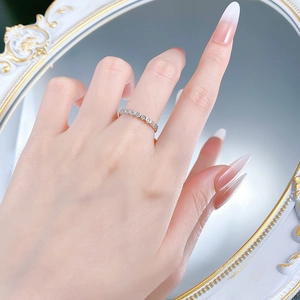 Close-up of S925 silver honeycomb band ring with full diamonds on a hand model