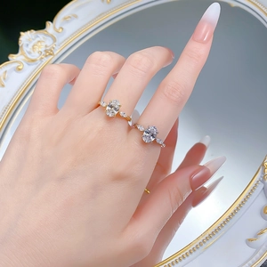Elegant S925 silver rings with oval center stone and marquise accents on a mirror