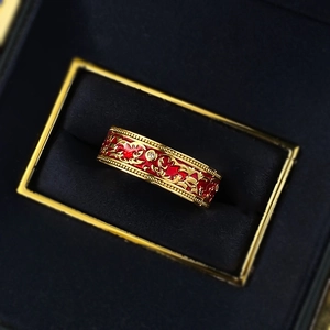Vintage S925 silver ring with red enamel and gold relief pattern in jewelry box