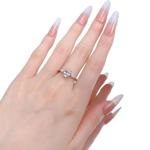 Elegant S925 silver ring featuring an oval clear gemstone with two pear-cut side stones