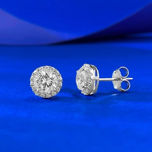 Elegant halo stud earrings featuring round cubic zirconia in a classic silver setting