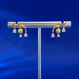Golden brushed lily of the valley earrings with hanging teardrop crystal tassels