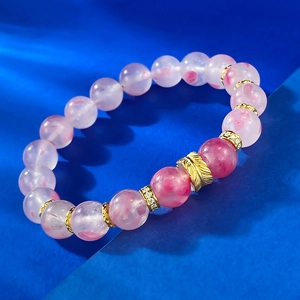 Elegant 9mm cherry blossom pink quartz beaded bracelet with a golden feather charm