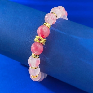 Elegant 9.0mm cherry blossom pink crystal bead bracelet with golden bow charm