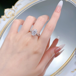 Detail of an S925 silver oval-cut solitaire ring with side micro-paved diamonds