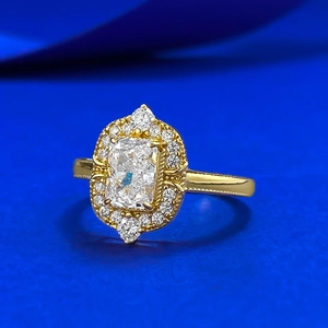 Vintage halo engagement ring with rectangular radiant cut stone and milgrain band
