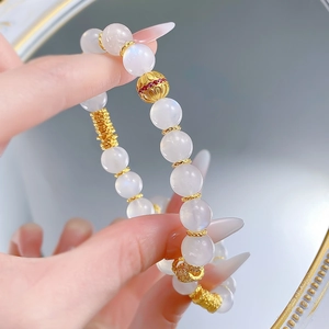 Elegant S925 silver moonstone bracelet with golden beads and red gemstone accents