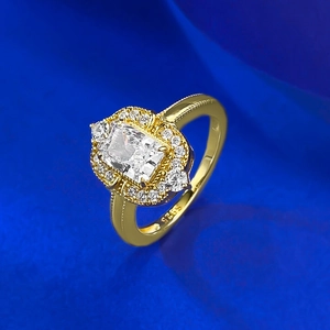 Macro detail of S925 engraved stamp and radiant cut diamond on vintage gold ring